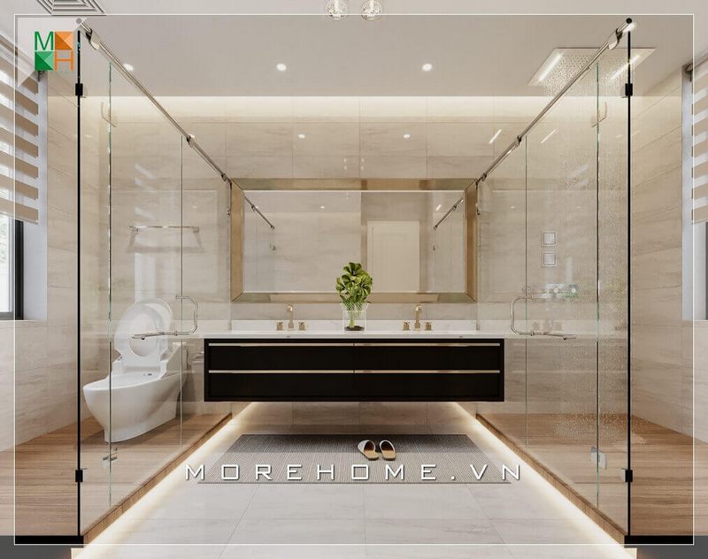 Mẫu thiết kế phòng tắm có diện tích lớn, có thể phân chia các khu vực bằng kính cường lực, ở giữa là hệ thống lavabo bằng đá cao cấp kèm gương to sang trọng